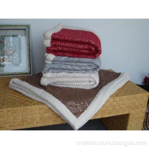 Embossed corduroy throw with sherpa backing and border